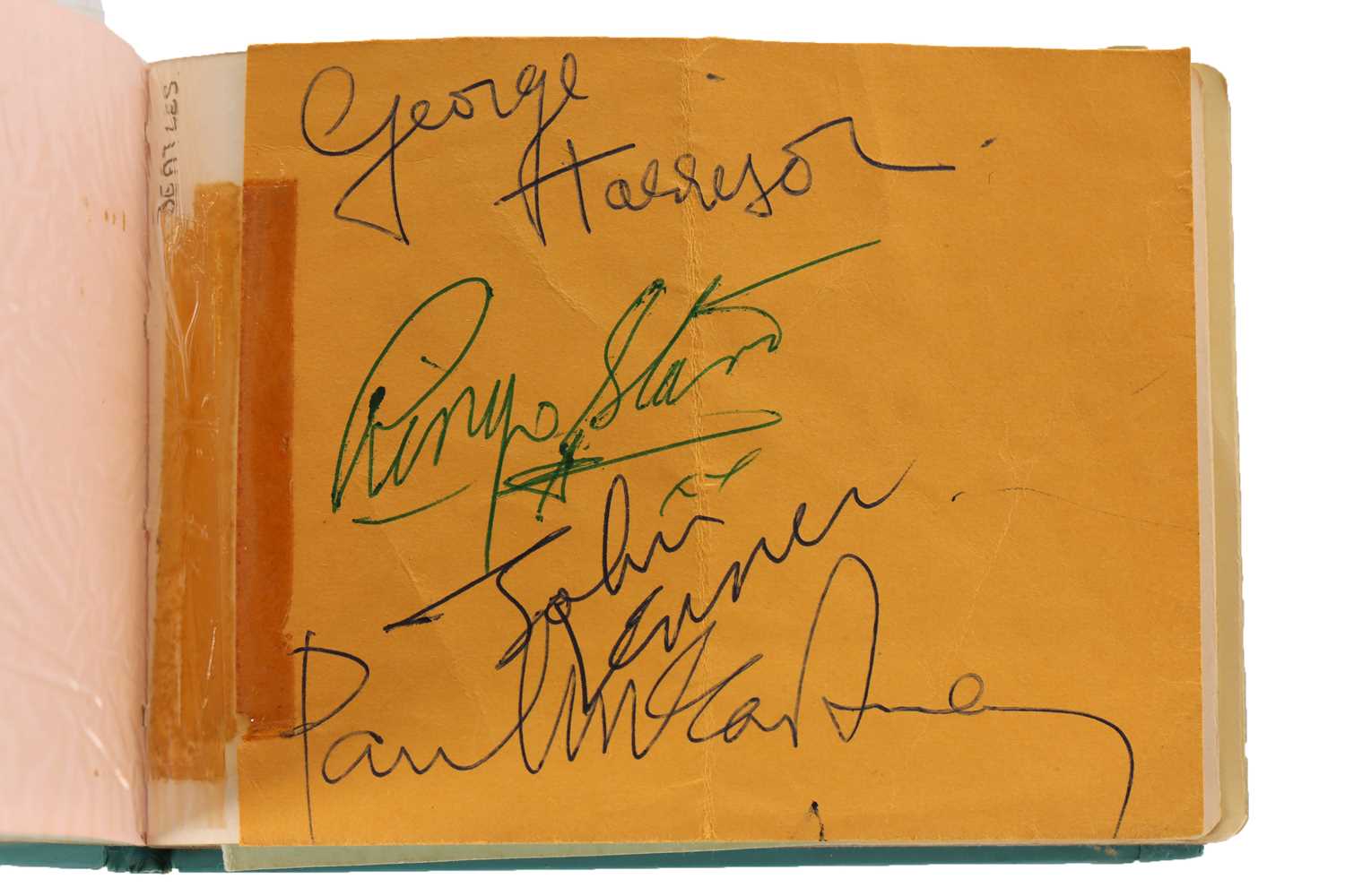 an autograph book signed by the beatles